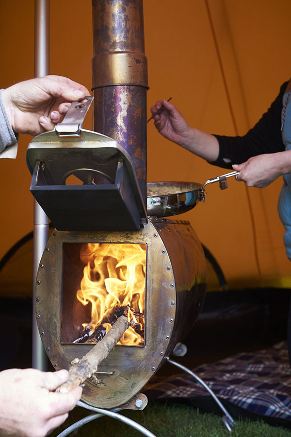 wood burning stove inside a tipi with wilderness weekends